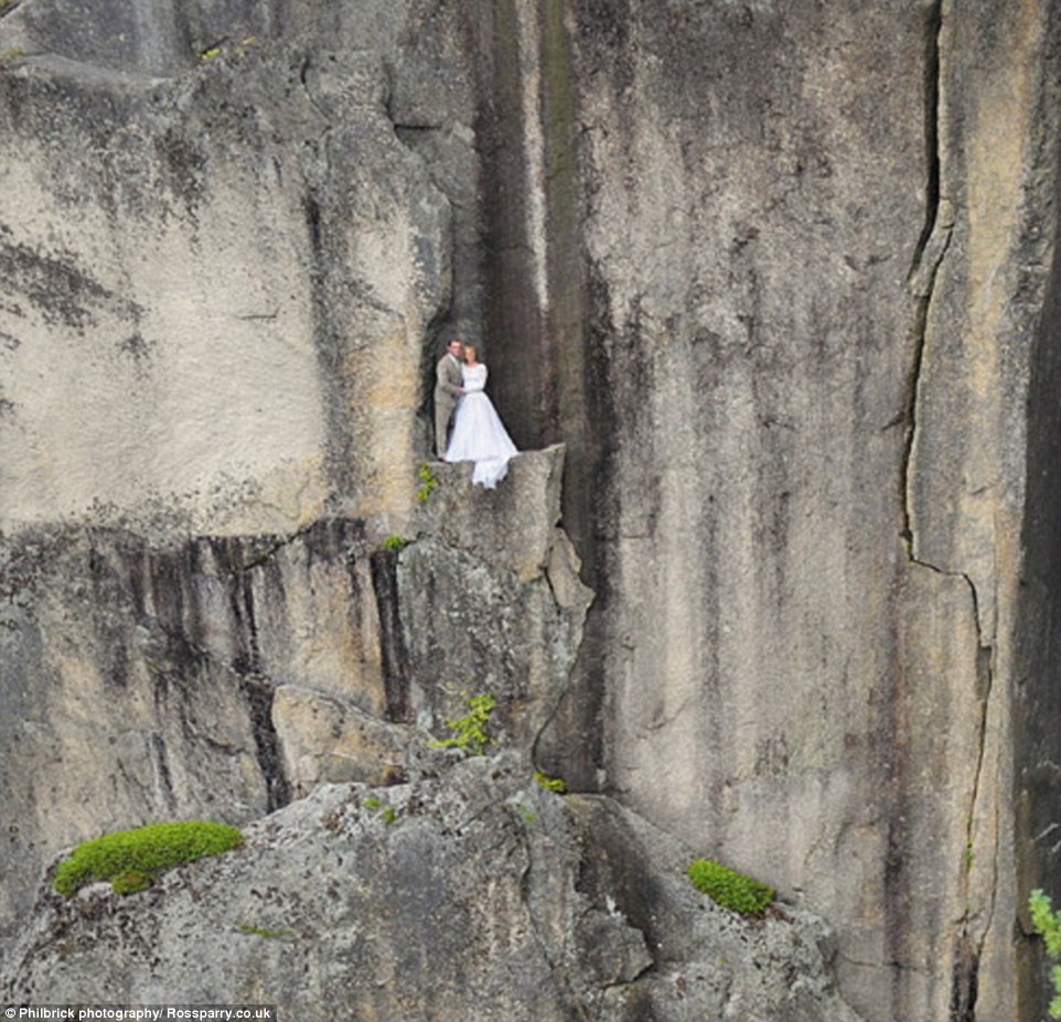Jay says that sometimes the bride will wear her dress as she's lowered on to the ledge, but some choose to change into their wedding finery once they're down there�