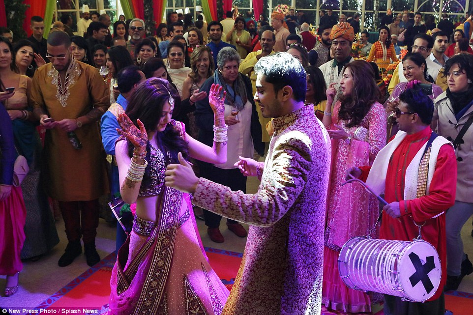 Today it is expected the marriage will be celebrated in All Saints Square, where there will be a procession led by the groom. Pictured are the couple at their party last night