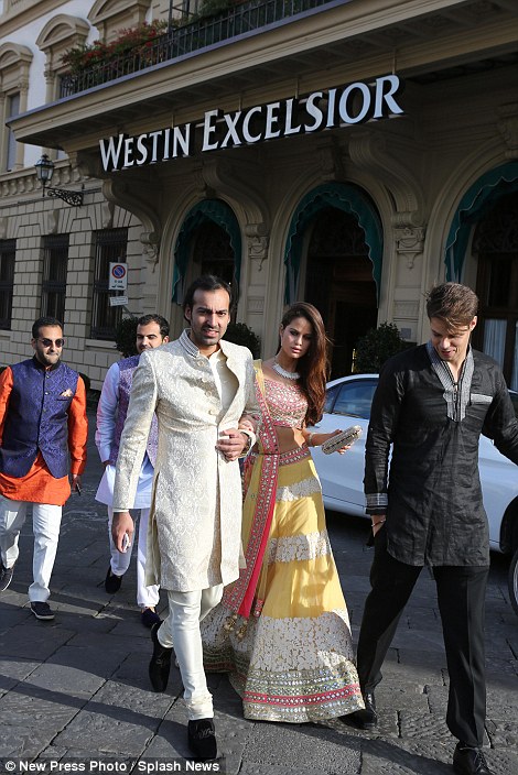 Guests attending the wedding in Florence used the occasion to dress up in the finery, wearing brightly coloured traditional dress