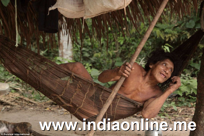 Relaxed: A tribe member poses for a photographer from Survival International, which has campaigned for the protection of the group